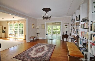 Library w/wet bar extends to Liv rm & Sun rm.