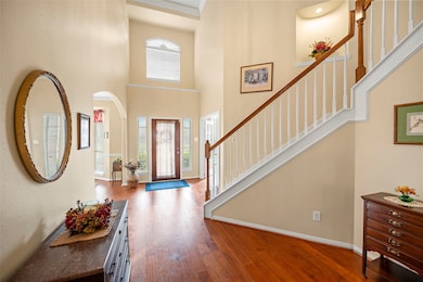 Open the door to a light and bright home!  High ceilings, gorgeous hardwood flooring and a traditional style staircase welcomes you home!
