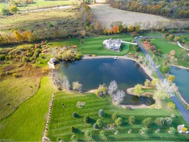 Aerial view of this amazing property and pond!
