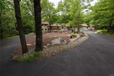 Front view with a long driveway
