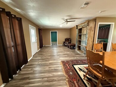 Dining space featuring wood finished floors, base