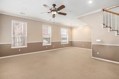 Formal living room, complete with ceiling fan. Wai