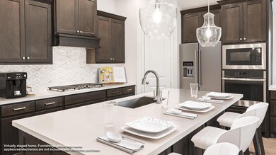 Kitchen with appliances with stainless steel fini