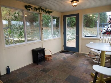 SUPER COZY AND WELCOMING SUN PORCH.  A GREAT PLACE