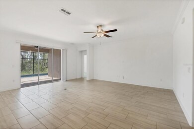 Living Room with Sliding Door view of Pool and Preserve.