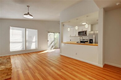 Unfurnished living room with vaulted ceiling, lig