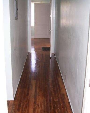 Hallway to living room view - hardwood floors