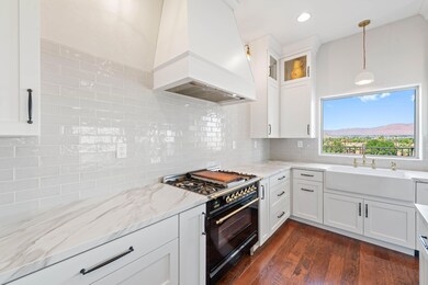 Immaculate kitchen with a hood