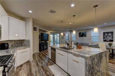 Kitchen with stainless steel appliances, dark wood