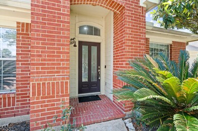 High ceiling covered front entrance patio.
