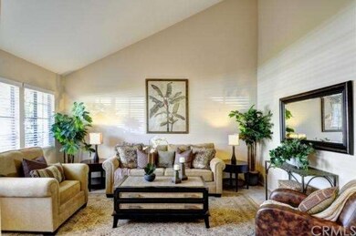 Formal living room with soaring ceiling and lots o