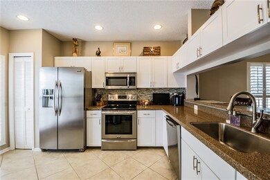 Another view of the kitchen. Canned lighting, farm