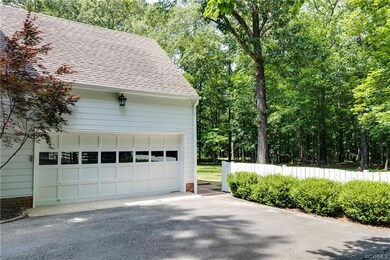 The 2-car, side entry garage also has pedestrian a
