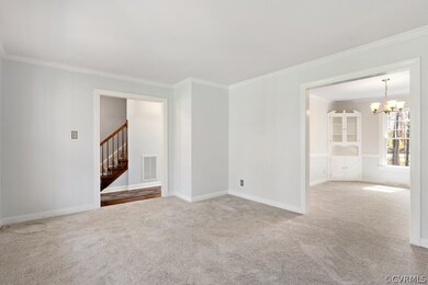 Formal living room with a view to the formal dinin