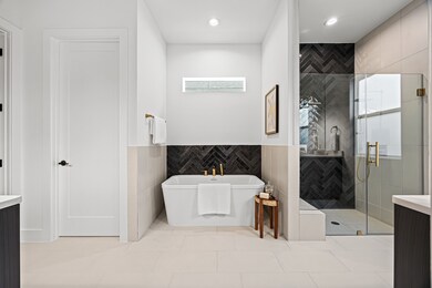 This elegant bathroom features a sleek freestandin
