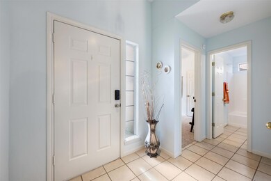 Entryway featuring light tile patterned flooring 