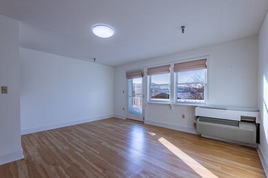 Living/dining area with SE exposure and views!