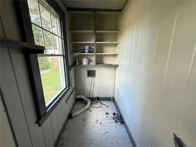 Washroom featuring hookup for a washing machine and plenty of natural light