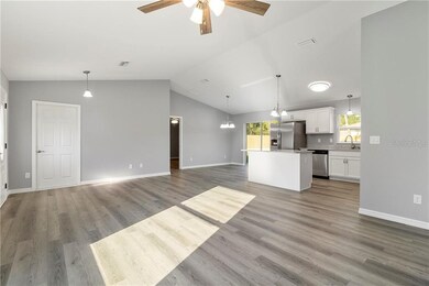 Open floorplan ~ spacious great room!  Vaulted ceilings.  Luxury vinyl plank flooring throughout.