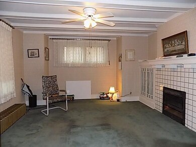 Timeless a fireplace & wooden beams adorn this 15 
