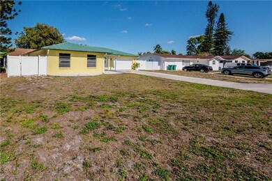 Ranch-style home with an attached garage, fence, c