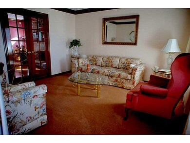 Living Room. large living room has french doors to