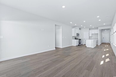 Unfurnished living room with light wood-type floor