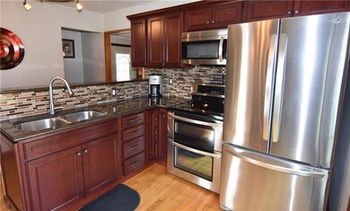Updated kitchen with wood flooring