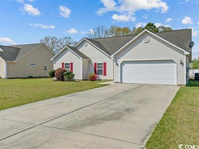 Ranch-style house featuring a front yard, concrete driveway, and a garage