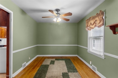 Formal Dining Room with natural wood floors.