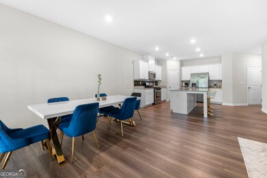 Dining area open to kitchen and living room.