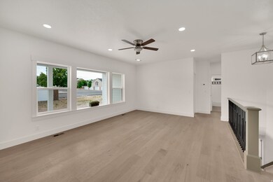 Unfurnished living room featuring recessed lighting, light wood-style floors, and a ceiling fan