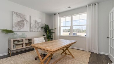 Office area featuring dark hardwood / wood-style f