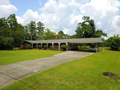 Paved Driveway and 2-Car Carport