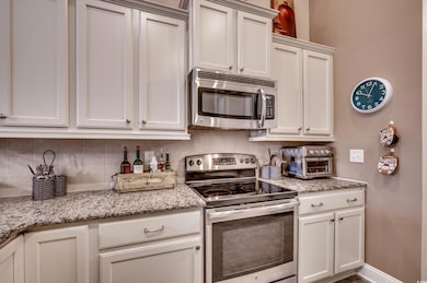 Kitchen featuring appliances with stainless steel 
