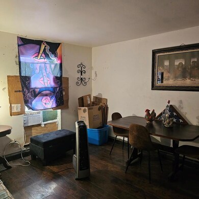 Dining area with hardwood / wood-style floors