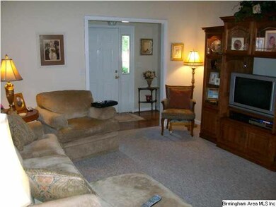 Large Family Room with fireplace and crown molding