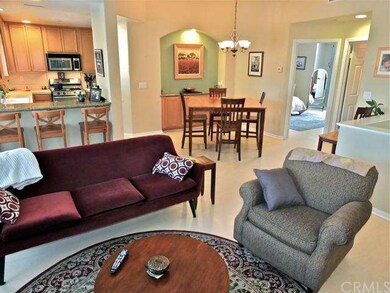 Living room with view of master suite in upper rig
