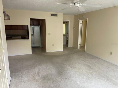 Living room looking toward kitchen area.