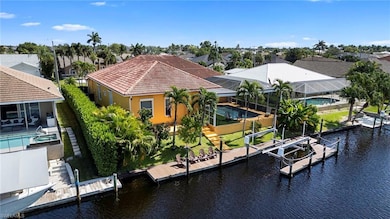 Dock featuring boat lift, a lanai, a water view, an outdoor pool, and a patio