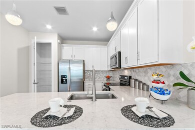 Kitchen with appliances with stainless steel finis