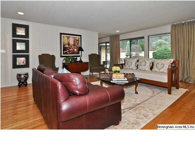 Sliding glass doors along the back allow the home 
