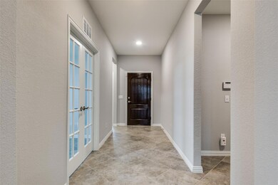Hallway with light tile floors