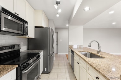 Kitchen with appliances with stainless steel finis