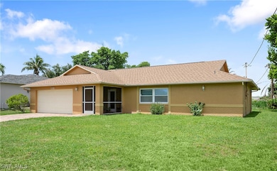 Ranch-style house featuring stucco siding, drivewa