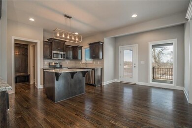 Breakfast area with center island.  Door to covere