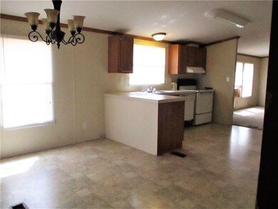 View of kitchen eating area with nice central ligh