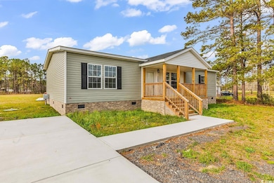 View of front of home with covered porch, a front 