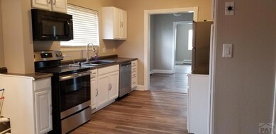 one side of kitchen showing new appliance