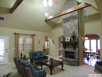 The family room features a vaulted ceiling, stacke